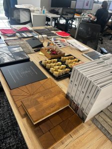 Flooring samples, brochures and refreshments laid out for the HLM Architects lunch and learn